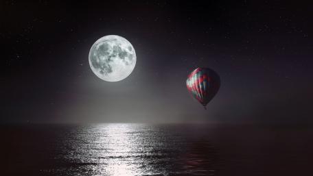Hot air balloon at full moon wallpaper