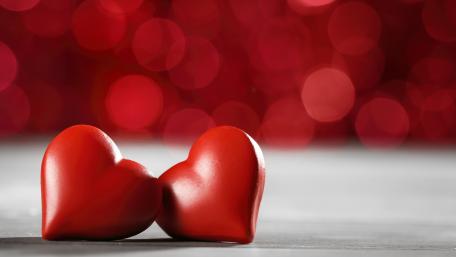 Red Hearts in Soft Bokeh Glow wallpaper