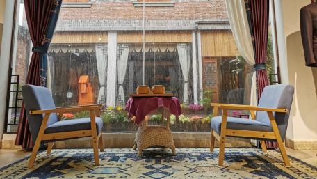 Cozy Corner with a Rainy View wallpaper