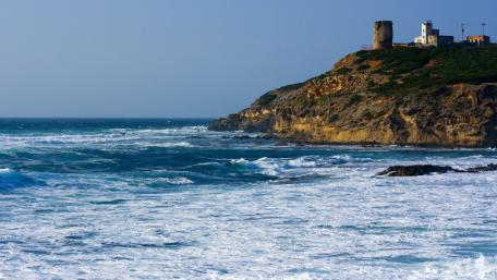 Breathtaking Coastal View with Turquoise Waves and Cliffs wallpaper