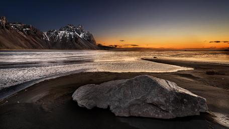 Serene Sunset Over Coastal Boulder Scene wallpaper