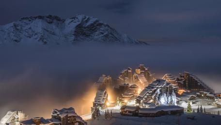 Enchanting Winter Village in Mountain Foggy Landscape wallpaper