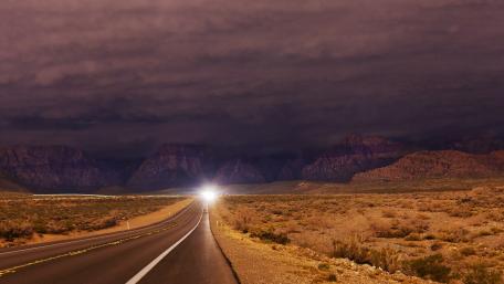 Mysterious Highway Under a Cloudy Sky wallpaper
