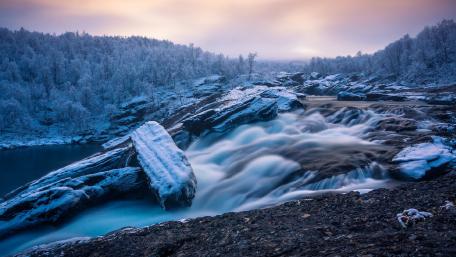 Serene Winter Waterfall Scene wallpaper