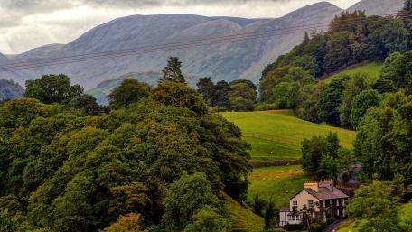 Scenic Mountain Landscape with Charming House wallpaper