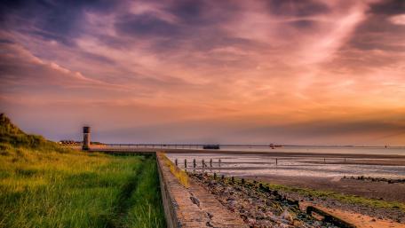 Serene Coastal Sunset Glow wallpaper