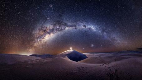 Celestial Wonder Over Desert Dunes wallpaper