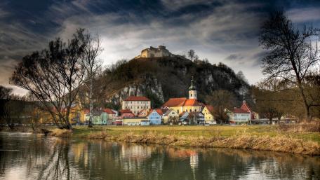 Serene Village Nestled by the River wallpaper