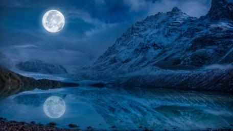 Majestic Moonlit Reflection in Winter Landscape wallpaper