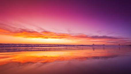 Serene Sunset Over Tranquil Beach Scene wallpaper