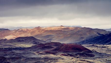 Majestic Mountain Range Under Dramatic Skies wallpaper