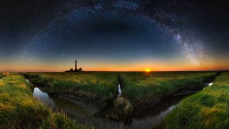 Celestial Serenity Above the Lighthouse wallpaper