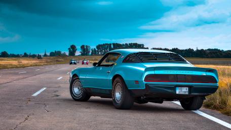 Blue Muscle Car on Open Road wallpaper
