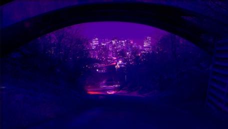 Vibrant Purple City Under the Night Sky wallpaper