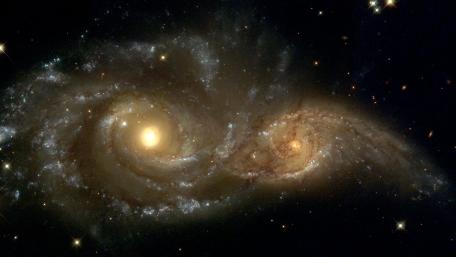 Mystical Dance of Spiral Galaxies in Space wallpaper