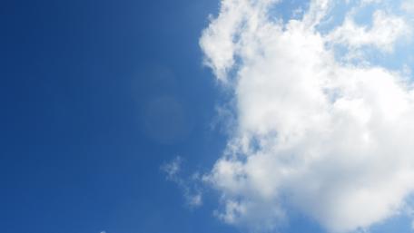Vivid Blue Sky with Fluffy Clouds wallpaper
