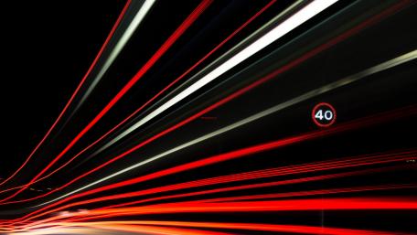 Vibrant Traffic Trails in Nighttime Urban Scene wallpaper