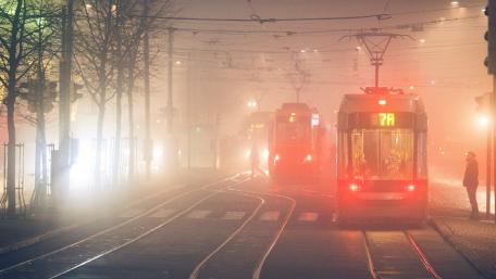 Tram Lights in Foggy City Evening wallpaper