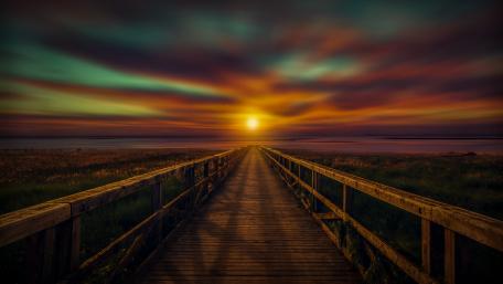 Radiant Sunset over Wooden Pier wallpaper