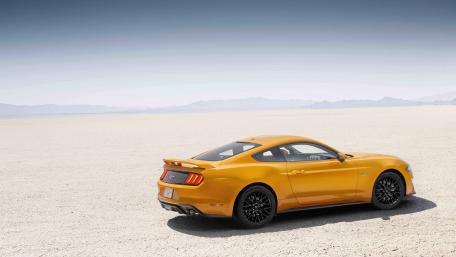 Desert Dream Ride in a Yellow Mustang wallpaper