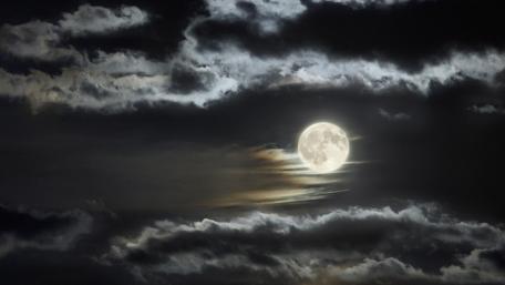 Moonlit Serenity in a Cloudy Night Sky wallpaper