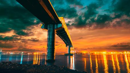 Sunset Splendor Over the City Bridge wallpaper