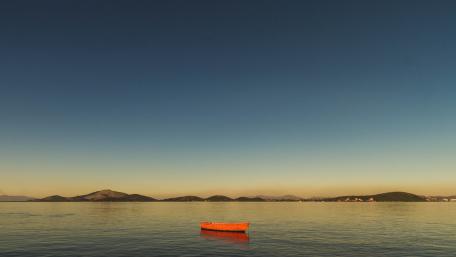 Solitary Red Boat at Dawn wallpaper