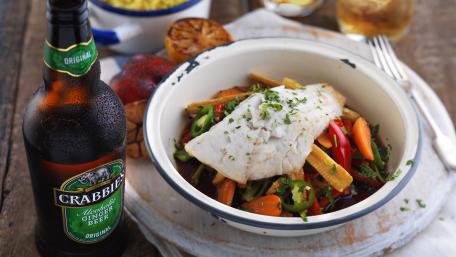 Delicious Beer and Fresh Dish on a Rustic Table Surface wallpaper