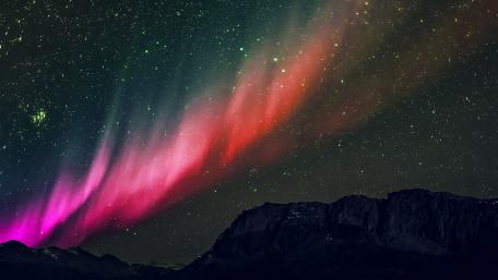 Aurora Dance Beneath a Starry Night Sky wallpaper