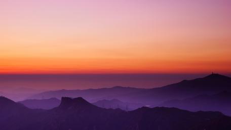 Mountains with orange sky wallpaper