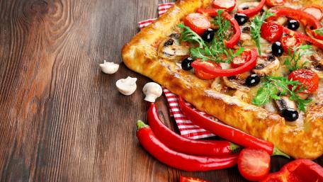 Delicious Pizza on a Rustic Wood Plank wallpaper