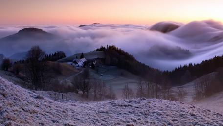Serene Sea of Clouds Over Rolling Hills wallpaper