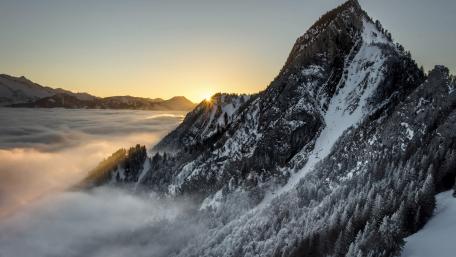 Majestic Mountain Peak Above the Clouds wallpaper