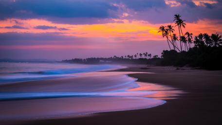 Tranquil Sunset Over Serene Beach Scene wallpaper