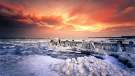 Frozen Pier Embraced by Winter's Glow wallpaper