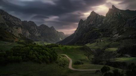 Majestic Mountain Valley with Serene Pathway wallpaper