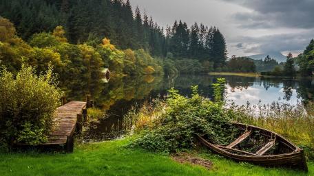 Serene Lake View with Old Pier and Boat House wallpaper