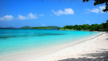 Tranquil Lagoon Beach Scene Under Clear Blue Sky wallpaper