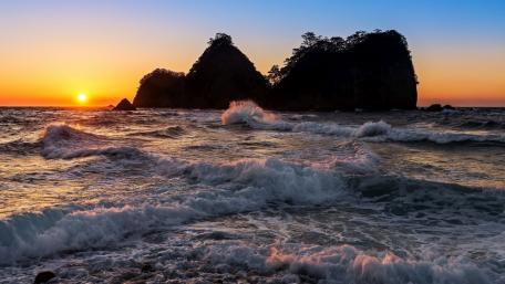 Serene Sunset Over Coastal Sea Stacks wallpaper