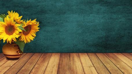 Vibrant Sunflowers on Rustic Wood Background wallpaper