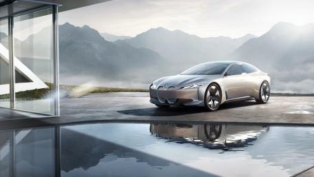 Sleek Elegance of the BMW i4 in Nature's Embrace wallpaper