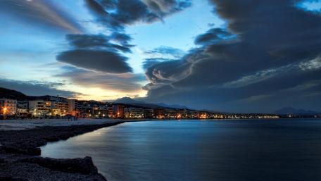 Serene Twilight Over the Coastal City wallpaper