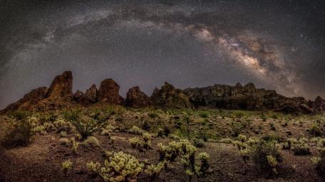 Majestic Milky Way Over Desert Landscape wallpaper