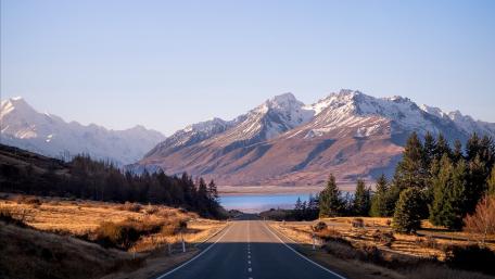 Scenic Mountain Road Journey in Nature's Embrace wallpaper
