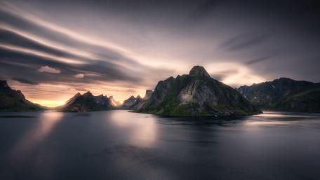 Majestic Fjord Under Cloudy Skies wallpaper