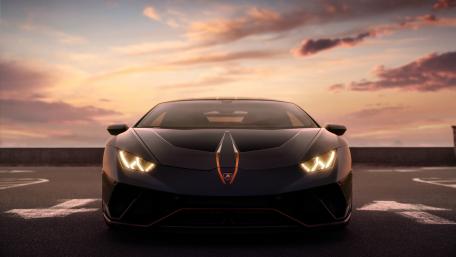 Sleek Lamborghini Huracan Against a Stunning Sunset wallpaper