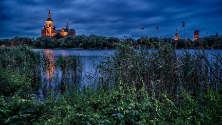 Serene Evening at the Lakeside Church wallpaper