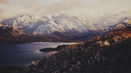 Serene Mountain Lake Surrounded by Majestic Peaks wallpaper