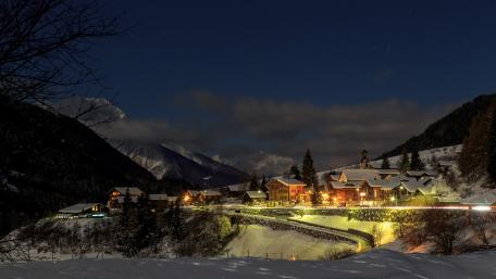 Charming Mountain Village Under Starry Night Sky wallpaper