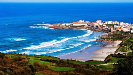Coastal Serenity Under Blue Skies wallpaper